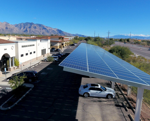 A solar carport providing shade to vehicles | Solar Gain